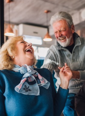 two seniors laughing